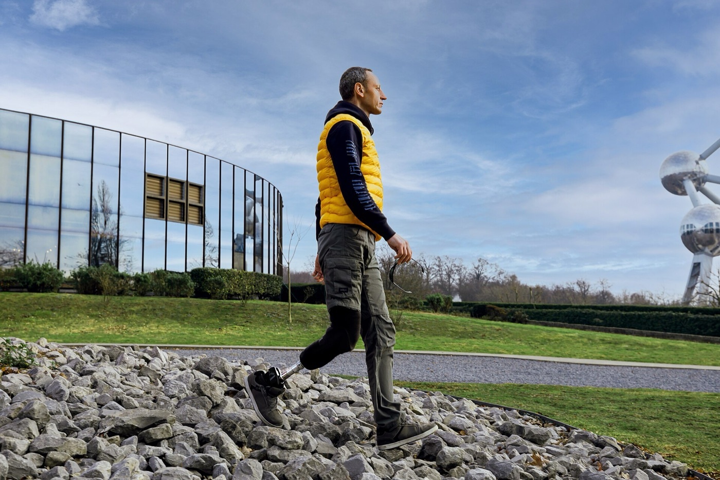 Figure 15. A transtibial (below-knee) amputee walking over rough ground on a prosthesis with an energy-storing foot, the level whose retained knee gives the lowest energy cost of gait. Source: Axiles Bionics, via Wikimedia Commons, CC BY-SA 2.0.